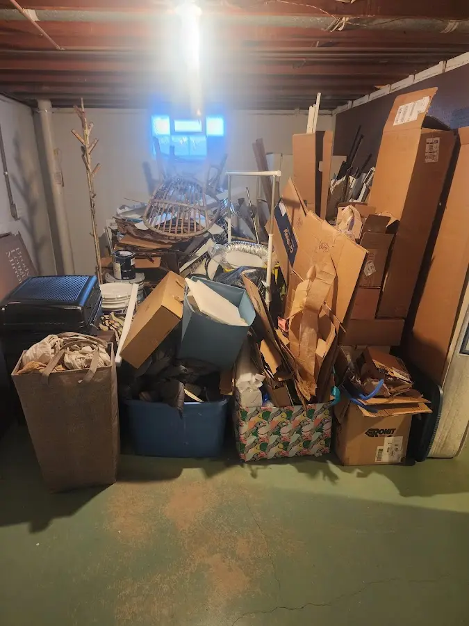 Roll-off dumpster container at job site for 2 Yard Dumpster Rental in Milton